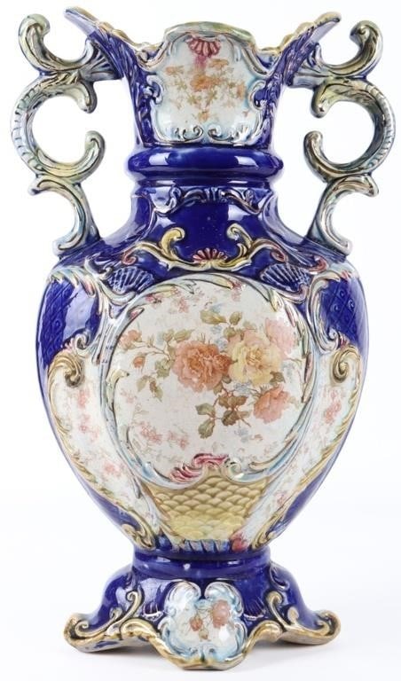 ANTIQUE MAJOLICA VASE W/ FINE FLORAL PAINTING BLUE: Antique blue Majolica vase with gold paint highlights and beautiful floral paintings on the foot, body, and neck. Size: 16 X 8.5 X 6.5" Condition: Wear commensurate with age. The wash is heavily chipp