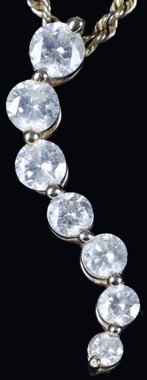 14K YELLOW GOLD NATURAL DIAMOND LADIES NECKLACE: 14K yellow gold natural diamond ladies rope chain necklace. Gemstones to include seven 0.04-0.20CT round cut natural diamonds. Diamonds tested natural via Gemlogis short wave UV fluorescence. Stone Ty