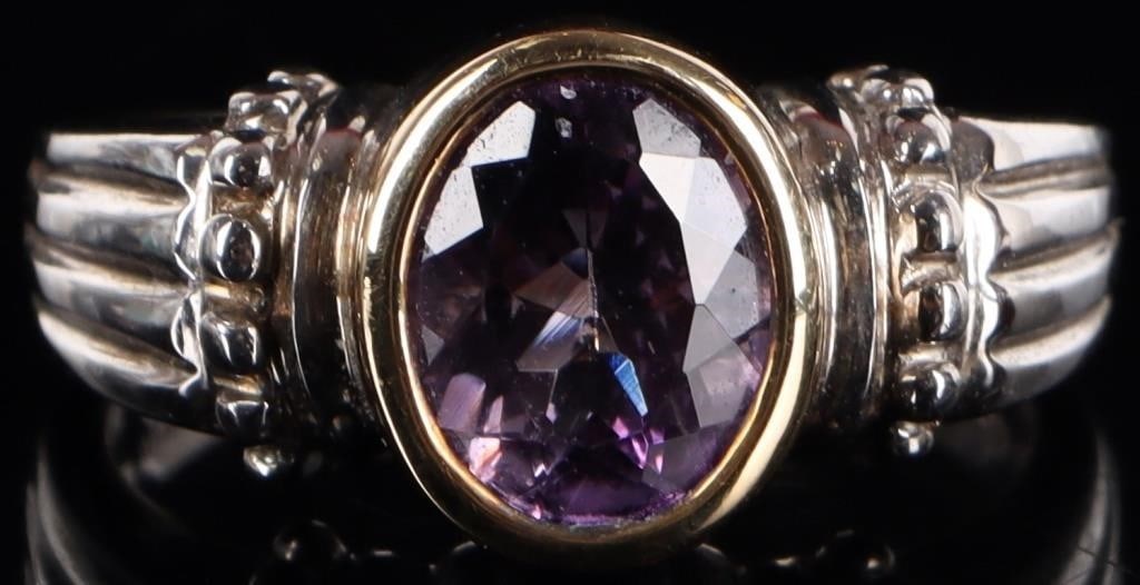 SW STYLE 14K YELLOW GOLD RIM 925 RING W 2CT AMETH: Southwest style sterling silver mens ring with a 2ct oval-cut amethyst center gemstone. The rim of the face around the center gem is 14k yellow gold plated. Stone Type: Amazonite Weight: 7.31 grams Si