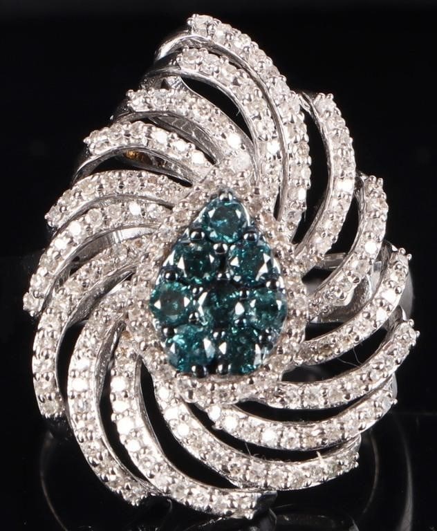 STERLING SILVER BLUE & WHITE DIAMOND LADIES RING: Sterling silver blue & white diamond ladies ring. Gemstones to include eight 0.04ct round cut blue diamonds in the shape of a pear, and one-hundred twenty 0.01ct round cut white diamonds. Stone Type: 