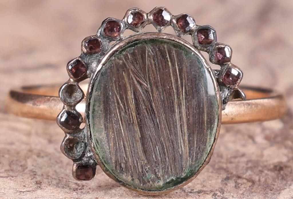 10K YELLOW GOLD LADIES RING W/ INCLUDED SPINEL: 10k yellow gold ladies ring with a polished spinel center gemstone with inclusions and eleven small tourmaline gemstones surrounding it. Stone Type: Spinel & Tourmaline Weight: 2.34 grams Size: US 6.5