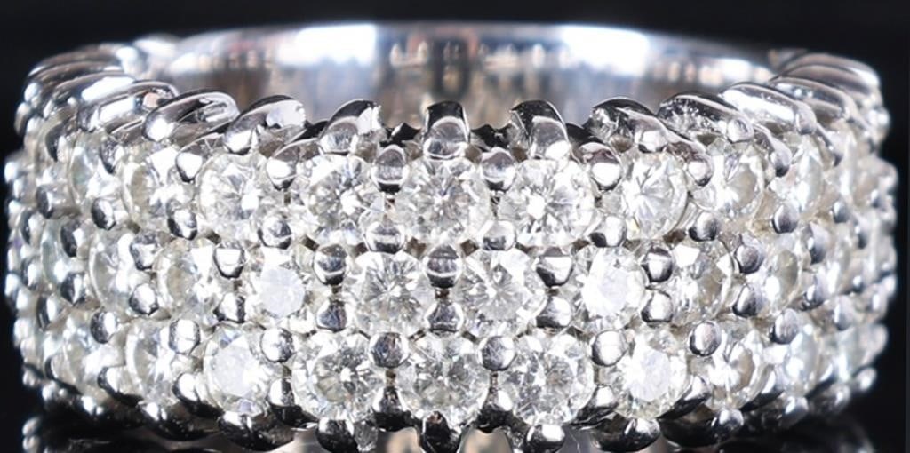 14K WHITE GOLD LADIES RING STUDDED W/ MOISSANITE: 14k white gold ladies ring the face of which is studded with moissanite stones. Stone Type: Moissanite Weight: 11.79 grams Size: US 7.5 Condition: See pictures.