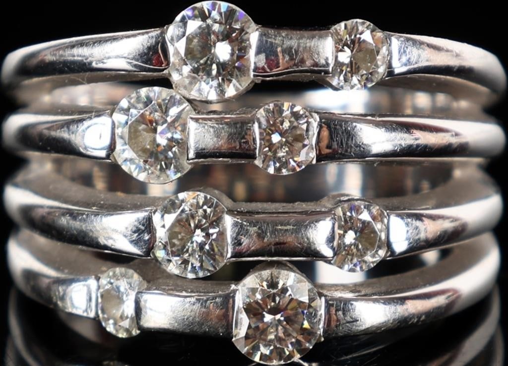 14K WHITE GOLD LADIES RING W/ BRIGHT MOISSANITE: 14k white gold multi-band ladies ring with eight moissanite stones scattered about the face. Stone Type: Moissanite Weight: 10.85 grams Size: US 7.25 Condition: See pictures.