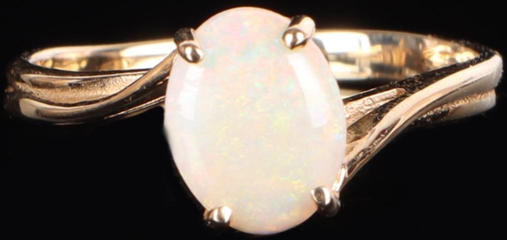 14K YELLOW GOLD CABOCHON OPAL LADIES RING: 14K yellow gold cabochon opal ladies ring. Gemstones to include one 8.83mm X 6.90mm cabochon opal. Stone Type: Opal Weight: 2.43 Grams Size: 7.25 U.S. Condition: Little to no wear, see images for deta