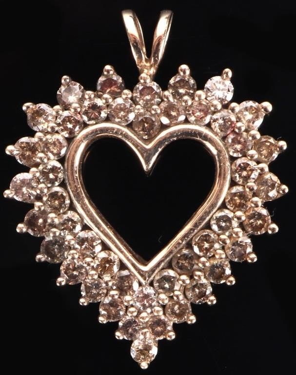 46 DIAMONDS 10K YELLOW GOLD LADIES HEART PENDANT: 10k yellow gold diamond-studded ladies heart pendant, to include 46 0.04ct round-cut diamonds (1.84ctw). Stone Type: Diamond Weight: 4.25 grams Size: 28.6 x 22.6mm Condition: See pictures.