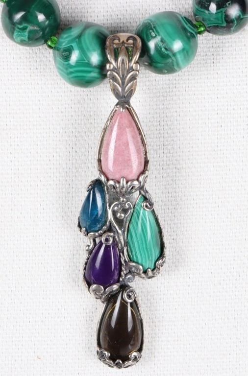HAND STRUNG NATURAL GREEN MALACHITE NECKLACE: Hand strung natural green malachite necklace paired with a multi-stone sterling silver Carolyn Pollach pendant. The pendant is set with multiple gemstones including pink rhodonite, amethyst, sodalite 