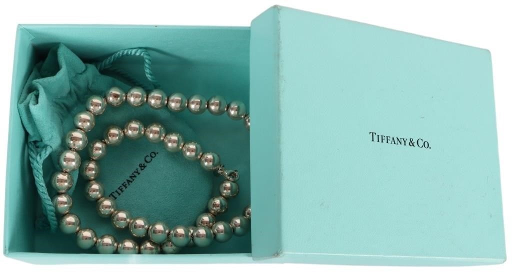 TIFFANY & CO STERLING BEADED BALL LADIES NECKLACE: Tiffany & Co. sterling silver ladies beaded ball necklace. All of the beads are the same size. Comes with original pouch and box. Weight: 47.27 Grams Size: 18" Condition: Like new. See images for comp