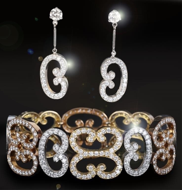 18K TRI-COLOR GOLD NATURAL DIAMOND SCROLL JEWELRY: 18K tri-color gold scrolling link natural diamond ladies jewelry set to include one bracelet and matching pair of earrings. Gemstones for the bracelet to include three-hundred eighty-three 0.02ct roun