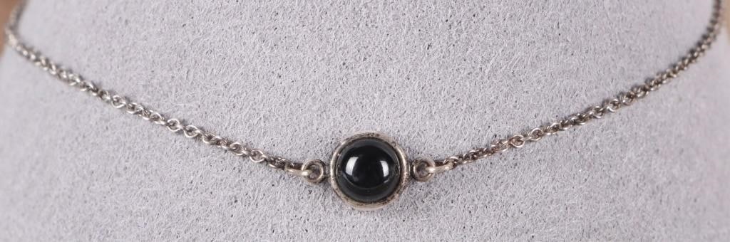 TIFFANY PERETTI STERLING SILVER BRACELET W/ ONYX: Sterling Silver Tiffany & Co. Peretti-signed sterling silver ladies bracelet with a polished onyx stone. Include onriginal bag. Stone Type: Onyx Size: 7.25" long Condition: Very Fine