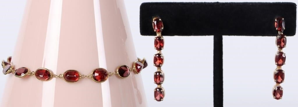14K YELLOW GOLD LADIES GARNET BRACELET & EARRINGS: Matching set of two pieces of 14k yellow gold jewelry with many garnet gemstones, to include a pair of dangle earrings (35 x 4.5mm) and a bracelet (7.5" long). Stone Type: Garnet Weight: 6.86 grams Si