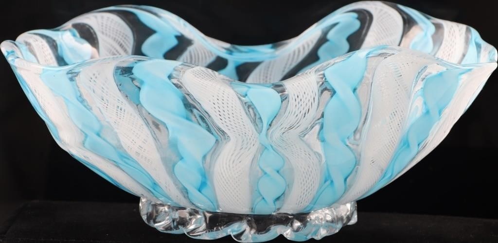 VINTAGE MURANO BOWL VENETIAN FILIGRANO RETORTOLI: Vintage Midcentury Modern Murano Venetian art glass bowl composed of alternating radiations of white filigrano and blue retortoli. Size: 6.5 X 5 X 3" Condition: Minor chip on the edge. See pictures fo
