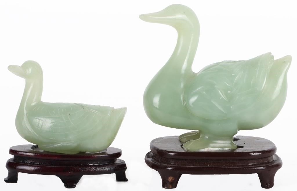 CARVED CHINESE GREEN NEPHRITE DUCK FIGURES: Carved Chinese green nephrite duck figures to include one larger duck and one smaller duck. Size: 3.5" Tall Condition: No chips, cracks or signs of repair. See images for complete condition.