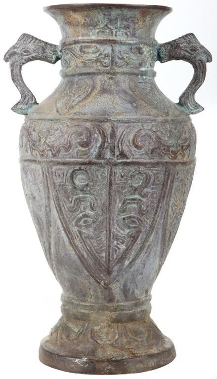 POSSIBLE 19TH CENTURY CHINESE BRONZE VASE/URN: Possible 19th century Chinese bronze vase/urn with zoomorphic symbols. There is a hole in the bottom possibly indicating it was used for ancient rituals, as a planter or even a steaming vessel. Has gr