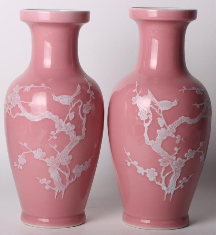 CHINESE BABY PINK PORCELAIN MARKED VASE PAIR: Chinese baby pink porcelain marked vase pair. Has traditional carvings of Chinese motifs. Size: 1.5" tall Condition: Very fine.