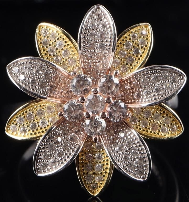 STERLING SILVER PINK SPINEL FLOWER LADIES RING: Sterling silver pink spinel flower ladies ring. This beautifully designed ring features a cluster of 6 round pink spinel surrounded with textured petals in yellow-tone and silver. The petals are