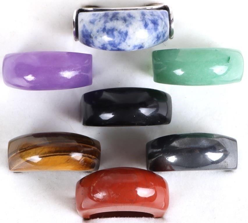 STERLING SILVER 7 INTERCHANGEABLE GEM RING SET: Sterling silver 7 interchangeable gem ring set to include: one polished sodalite, one lavender jade, one green jade, one black onyx, one hematite, one tiger's eye, and one red jasper carved ring attac