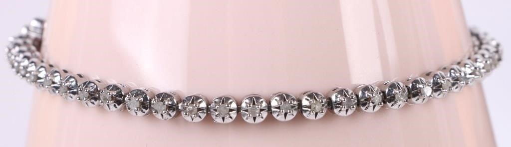 0.50CTW EARTH-MINED DIAMOND STERLING BRACELET: 0.50CTW Earth-mined diamond sterling silver ladies bracelet. With fifty 0.01ct round diamonds. Stone Type: Diamond Weight: 8.8 Grams Size: 8.0" Length Condition: Very fine.