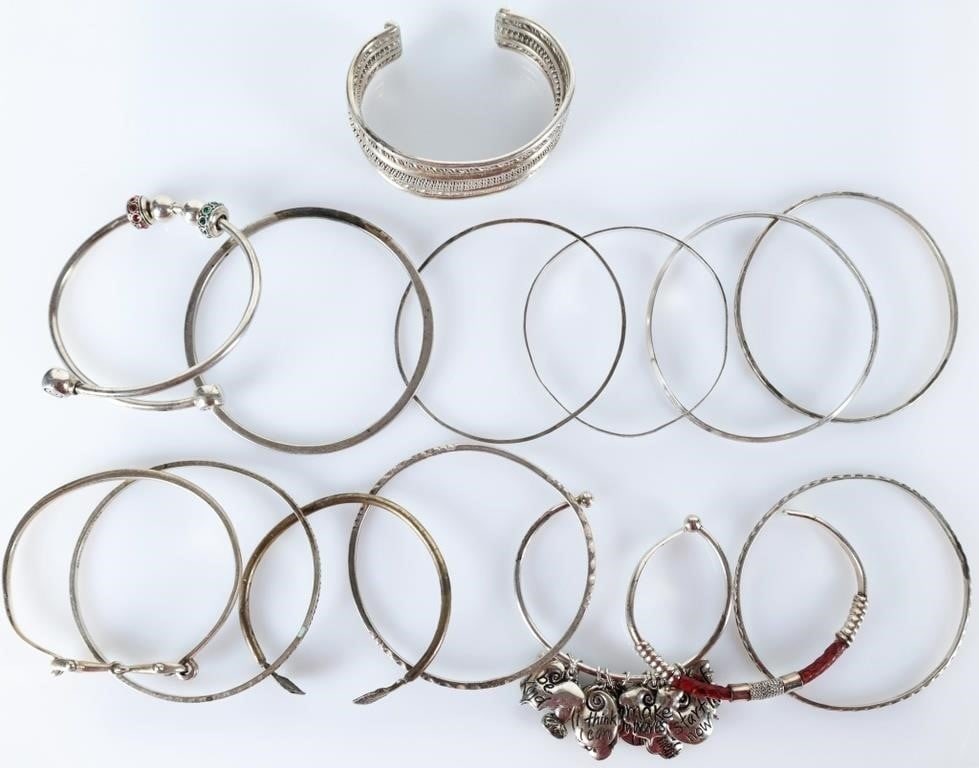 STERLING SILVER LADIES BANGLE/CUFF BRACELETS (14): This lot contains 14 different ladies sterling silver bracelets. There are 5 cuff bracelets and 9 bangle bracelets. All bracelets will fit a 7" wrist. Weight: 240.60 Grams Size: All will fit a 7"
