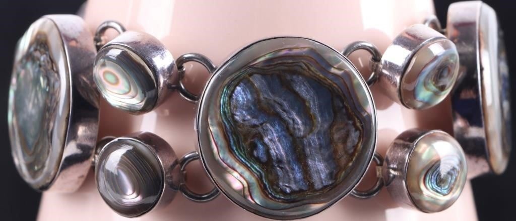 MEXICO STERLING SILVER LADIES BRACELET W/ MOP: Mexico Southwest style sterling silver ladies bracelet with large mother of pearl pieces arranged along its length. Stone Type: Mother of Pearl Weight: 69.09 grams Size: 8.75" long Condition: See