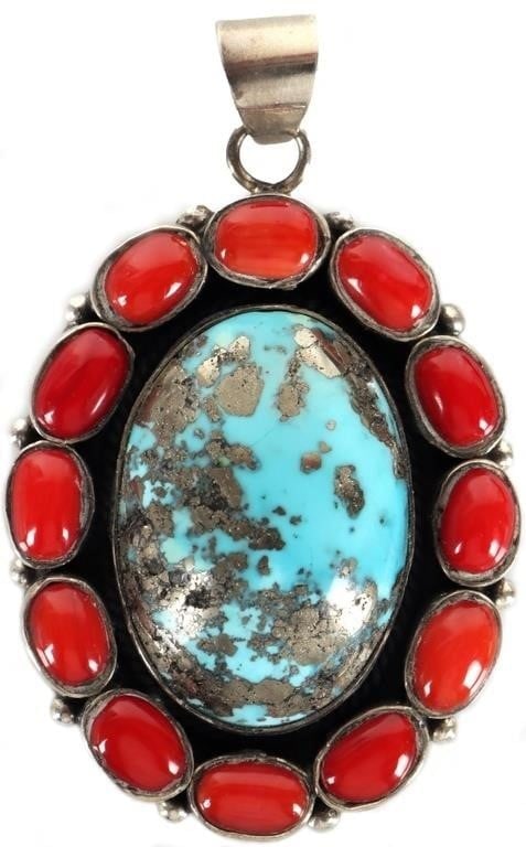 SW STYLE 925 LADIES TURQUOISE & JASPER PENDANT: Southwest style sterling silver ladies pendant with a large turquoise center stone surrounded by multiple red jasper stones. Stone Type: Turquoise Weight: 56 grams Size: 70 x 43 mm Condition: See pict