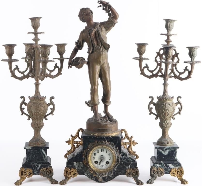 MANTEL CLOCK & 2 CANDELABRAS SET MARBLE BRONZE: Victorian mantelpiece set, to include one clock and two candelabras. The clock is green marble with bronze legs and flourishes. On top of it is a statue of a cherry picker, based on a design by the 19