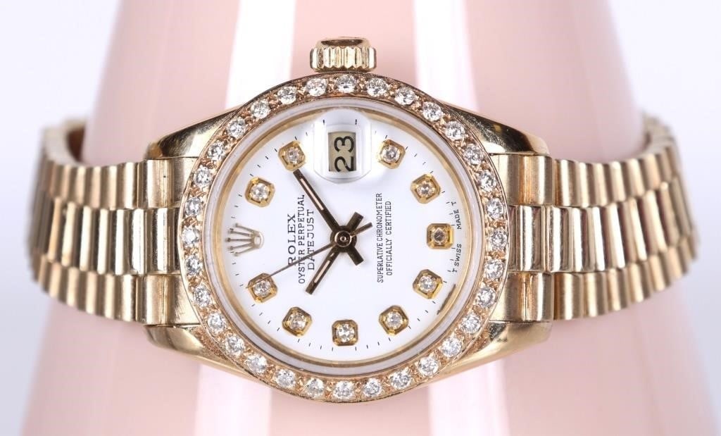 1979 ROLEX 18K YG 6917 PRESIDENTIAL LADIES WATCH: 1979 Rolex 18K yellow gold Ladies Date Presidential 6917 wristwatch. This beautiful watch features a sapphire crystal, an automatic 2035 movement, a diamond adorned bezel, a white dial with tritium ha