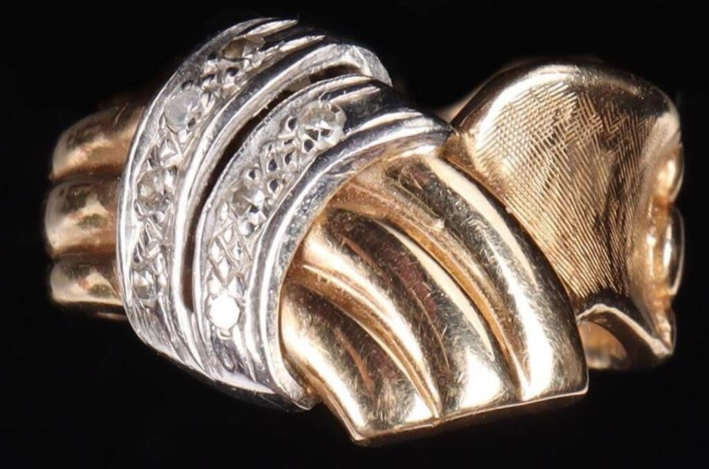 14K YELLOW/WHITE GOLD LADIES RING W/ DIAMONDS: 14K yellow gold ladies ring. The design features two ends resembling cloth folded over one another. The left-hand cloth is divided into three sections and features two white gold bands over its center