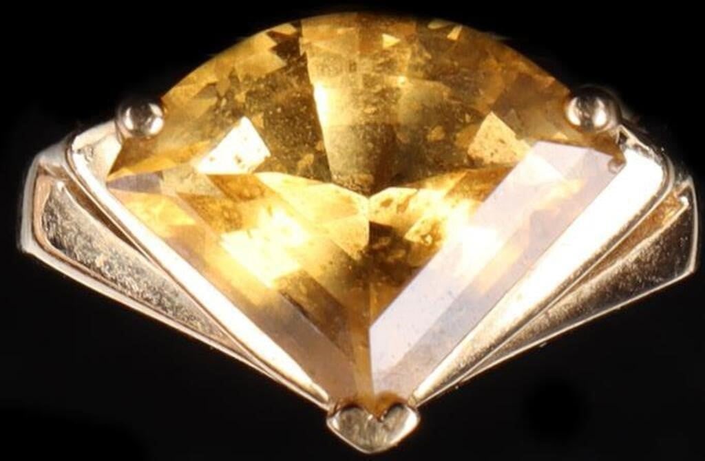 14K YELLOW GOLD FAN FACETED CITRINE LADIES RING: 14K yellow gold fan faceted citrine ladies ring. Gemstones to include one 12.63mm X 8.10mm fan cut citrine. Stone Type: Citrine Weight: 4.56 Grams Size: 6.00 U.S. Condition: Little to no wear, see ima