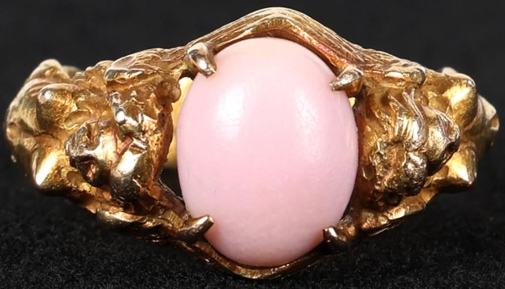 14K YELLOW GOLD PINK CORAL MERMAID LADIES RING: 14K yellow gold pink coral mermaid ladies ring. Gemstones to include one 10.50mm X 8.25mm cabochon pink coral. Stone Type: Coral Weight: 8.00 Grams Size: 5.50 U.S. Condition: Little to some wear, see 