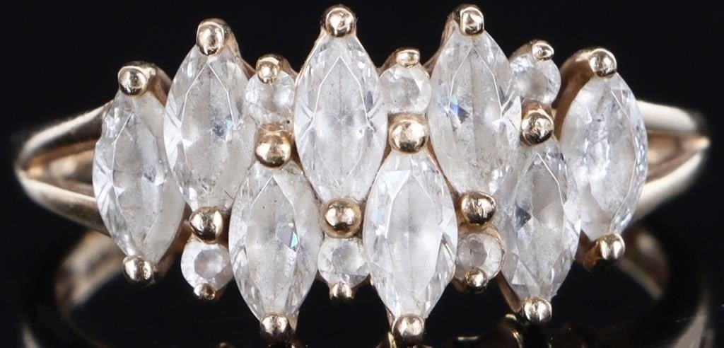 14K YELLOW GOLD LADIES RING W/ CUBIC ZIRCONIUM: 14k yellow gold ladies ring w/ marquise and round-cut cubic zirconium stones across the face. Stone Type: Cubic Zirconium Weight: 4.52 grams Size: US 10 Condition: See pictures.