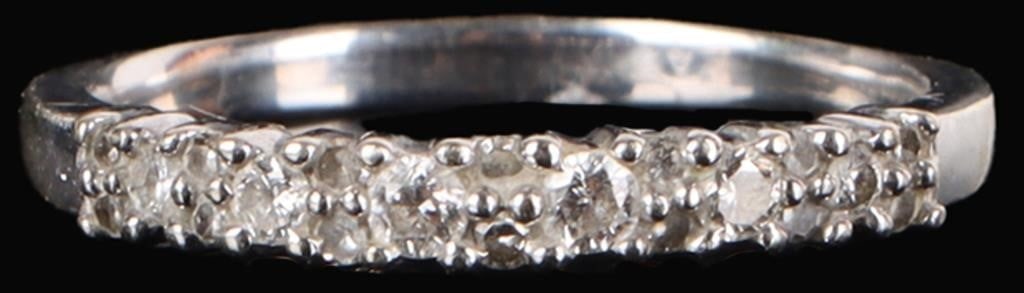14K WHITE GOLD LADIES RING W/ TWENTY DIAMONDS: 14k white gold ladies ring with seven vertical pairs of melee diamonds and six 0.01ct round-cut diamonds arranged in an alternating pattern along the face. Stone Type: Diamond Weight: 1.89 Size: US 6 