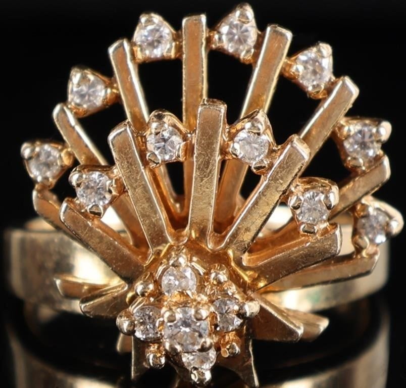14K YELLOW GOLD DIAMOND ROTATING FAN LADIES RING: 14K yellow gold diamond rotating fan ladies ring. Gemstones to include one 0.02ct round cut diamond and fifteen 0.01ct round cut diamonds. This unique ring features 2 freely rotating fans stacked on a