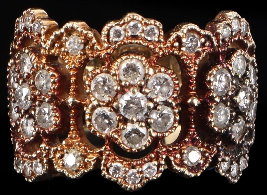 1.13 CTW DIAMONDS 14K YELLOW GOLD LADIES RING: 14k yellow gold ladies ring with three gorgeous diamond rosettes along the face, to include three 0.05ct diamonds each of which are surrounded by six 0.04ct diamonds (eighteen total) with three 0.02ct