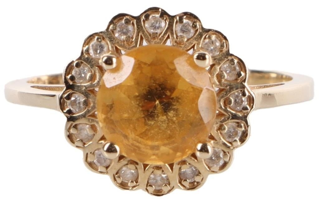 14K YELLOW GOLD LADIES RING W/ 2CT CITRINE & DIAS: 14k yellow gold ladies ring with a 2ct round-cut citrine center stone surrounded by sixteen 0.02ct round-cut diamonds. Stone Type: Diamonds & Citrine Weight: 3.2 grams Size: US 8.25 Condition: See pic