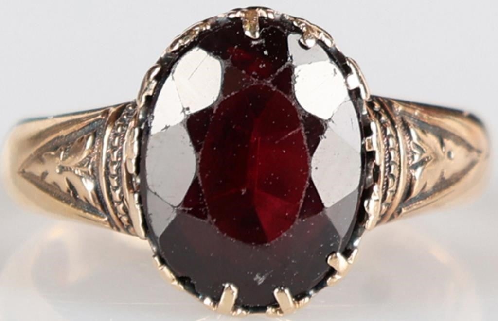 1.5CT OVAL GARNET 14K YELLOW GOLD LADIES RING: 1.5CT oval garnet 14k gold ring. Stone Type: Garnet Weight: 3.53 Grams Size: US 5.0 Condition: Slight surface scratches on band and stone from normal wear. See images for complete condition.
