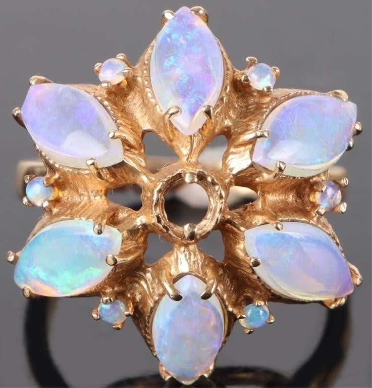 14K YELLOW GOLD OPAL FLOWER DESIGN LADIES RING: 14K yellow gold opal flower design ladies ring. Gemstones to include six 0.50ct marquise cabochon opal and six 0.01ct round cabochon opal. Stone Type: Opal Weight: 7.00 Grams Size: 7.50 U.S. Condition