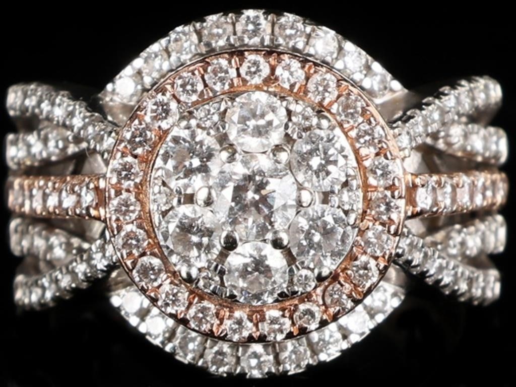 1.6 CTW 106 DIAS 14K WHITE/ROSE GOLD LADIES RING: 14k gold ladies ring. The piece is predominantly white gold save for a rose gold border and accent down the middles of the shoulders. All diamonds on the ring are natural. The piece features twenty-si