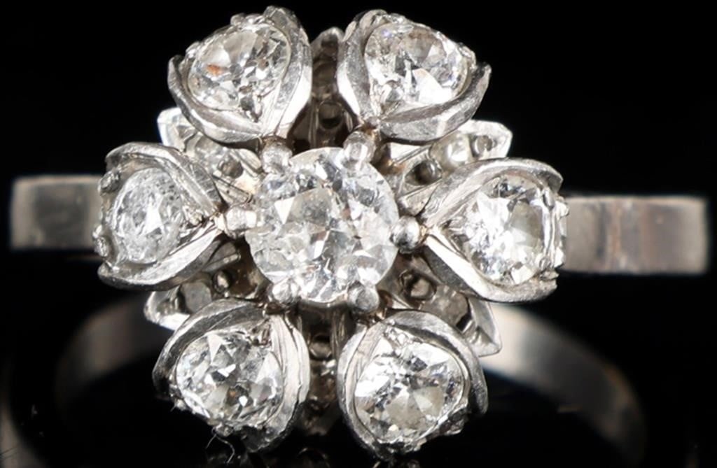 1.03CTW DIAMONDS 14K WHITE GOLD LADIES CROWN RING: 14k white gold ladies ring with a face designed like a crown or cushion. The piece features one 0.25ct round-cut center diamond and six 0.07ct, six 0.04ct, and six 0.02ct round-cut accessory diamonds 