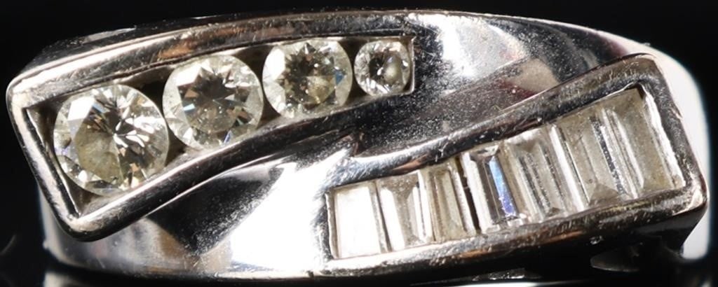 SHINY & BOLD 14K WHITE GOLD MENS RING W/ DIAMONDS: Shiny 14k white gold mens ring designed in with two intersecting projections. One features seven rectangular melee diamonds and the other features a 0.2ct, a 0.1ct, a 0.07ct, and a 0.02ct round-cut di