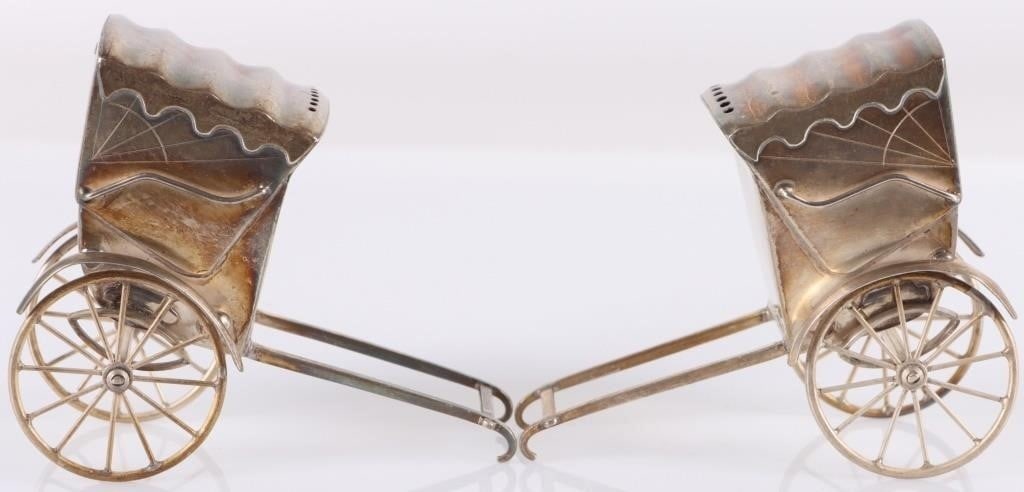 ANTIQUE 950 STERLING SILVER RICKSHAW SHAKERS: Antique set of 950 sterling silver Japanese covered rickshaw salt & pepper shakers. The wheels turn, completing the novelty of this unusual group of items. Weight: 63.67 grams total Size: 2.75 x 2.25 