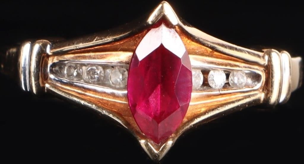10K YELLOW GOLD PINK RUBY DIAMOND LADIES RING: 10K yellow gold pink ruby diamond ladies ring. Gemstones to include one 0.50ct marquise cut pink ruby, and six 0.01ct round cut diamonds. Stone Type: Assorted Weight: 2.35 Grams Size: 7.00 U.S. Condit