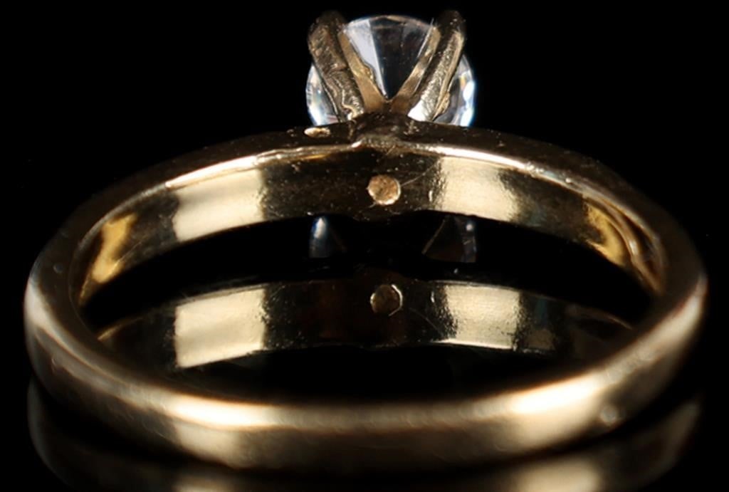 1/3CT DIAMOND SOLITAIRE 10K ENGAGEMENT RING: 1/3CT diamond solitaire ladies engagement ring set in 10K yellow gold. Stone Type: Diamond Weight: 2.15 Grams Size: US 5.5 Condition: Slight surface scratches on band from normal wear. No chips or scr