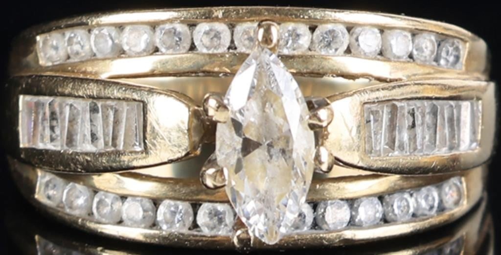 10K YELLOW GOLD LADIES TRI-BAND RING W/ DIAMONDS: 10k yellow gold tri-band ring with diamonds. The center band features a 0.5ct marquise-cut center diamond flanked by melee diamonds. The top and bottom bands feature a row of thirteen 0.01ct round-cut