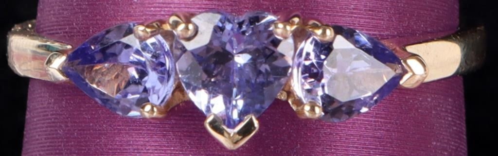 10K YELLOW GOLD LADIES RING W/ TANZANITE GEMSTONES: 10k yellow gold ladies ring with a 0.33ct heart-cut tanzanite center gemstone flanked by two 0.3ct pear-cut tanzanite accessory gemstones. Stone Type: Tanzanite Weight: 1.96 grams Size: US 8 Condition
