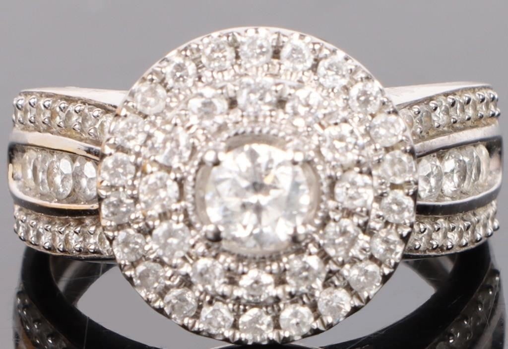 1.25CTW NATURAL DIAMOND DOUBLE HALO ENGAGMENT RING: 1.25CTW natural round cut diamond double halo engagement ring in 10K white gold Stone Type: Diamond Weight: 5.31 Grams Size: 7.0 Condition: Very fine.