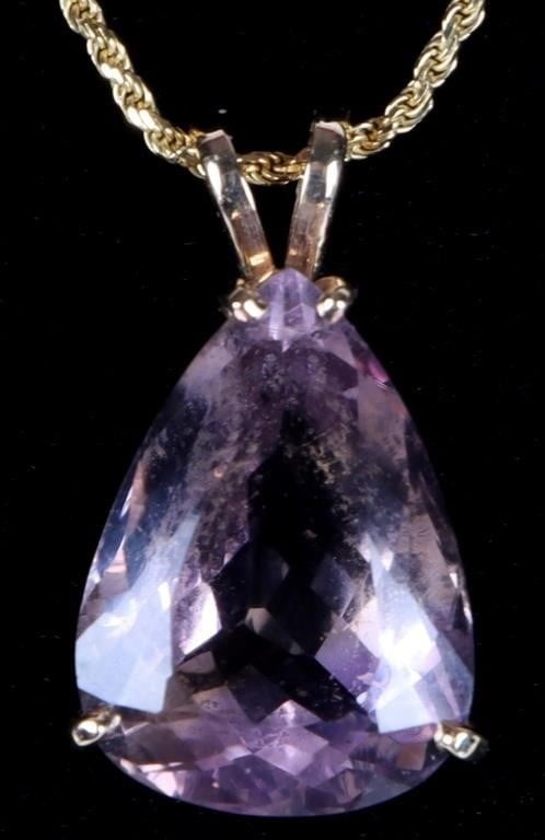 14K YELLOW GOLD AMETHYST LADIES NECKLACE: 14K yellow gold amethyst rope chain ladies necklace. Gemstones to include one 18.73mm X 13.65mm tear drop cut amethyst. Stone Type: Amethyst Weight: 7.49 Grams Size: 18.00" Condition: Little to no wea