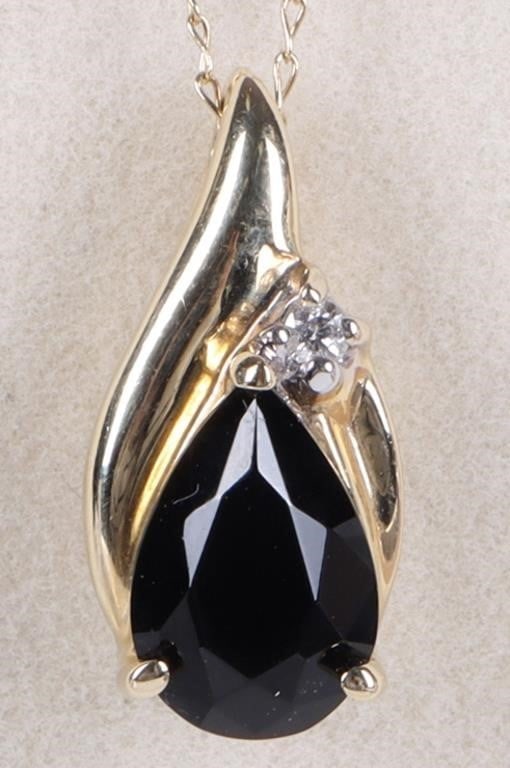 14K YELLOW GOLD LADIES NECKLACE W/ OBSIDIAN & DIA: 14k yellow gold ladies necklace with a pendant that includes a 0.75ct pear-cut obsidian stone and a 0.03ct round-cut accessory diamond positioned above it. Stone Type: Diamond & Obsidian Size: 16.5" l