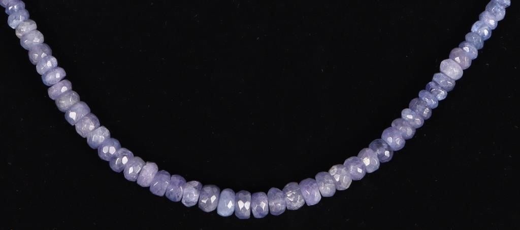 14K YELLOW GOLD CLASP IOLITE LADIES NECKLACE: Ladies necklace with a 14k yellow gold clasp and chain and dozens of rough iolite stones throughout its length. The clasp features a magnetic attachment. Stone Type: Iolite Weight: 1.7 grams gold weig