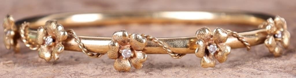 14K YELLOW GOLD NATURAL DIAMOND FLORAL BRACELET: 14K yellow gold natural diamond floral adorned bracelet. Gemstones to include five 0.03ct round cut natural diamonds. Stone Type: Diamond Weight: 10.18 Grams Size: 8.00" Condition: Little wear, see im