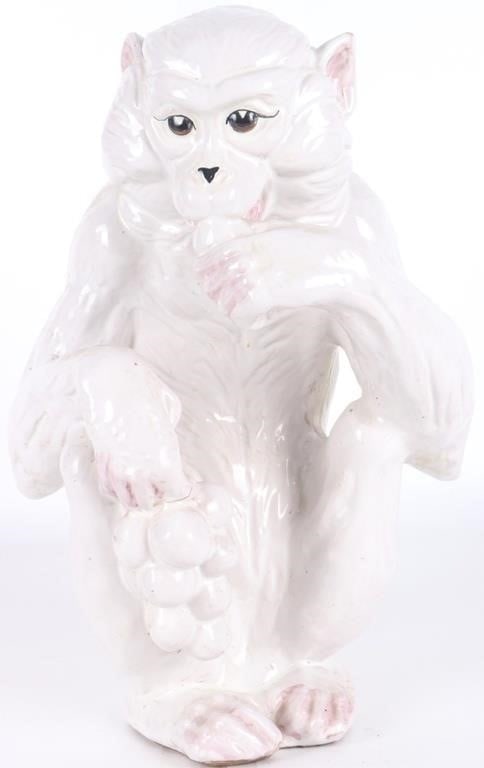 VINTAGE ITALIAN BARBOTINE-SLIP CERAMIC MONKEY: Vintage Italian Barbotine-slip ceramic sculpture of a monkey eating grapes. While decor is sparse, the piece features subtle yet lifelike pink highlights on the ears, fingers, and toes while the eyes 